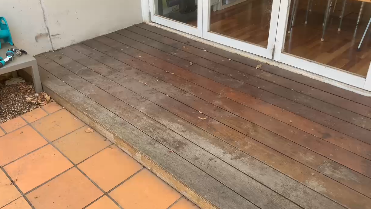 Aussie clear decking oil before shot on a timber deck